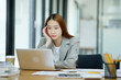 © ijeab - Female employees are stressed and tired. Headache from thinking and pressure from work.