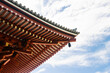Details of corner of Japanese traditional temple roof with blue sky, copy space