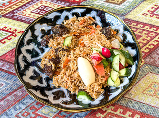 Poster - Uzbek pilaf on a plate on the table