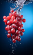 Pink large grapes falling with splashes into water. Banner. Dark background.