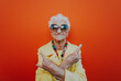 © oneinchpunch - Funny grandmother portraits. Senior old woman dressing elegant for a special event. Rockstar granny on colored backgrounds
