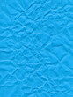 Surface of colored paper, sheet of crumpled blue paper