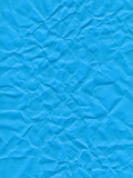 Fototapeta  - Surface of colored paper, sheet of crumpled blue paper