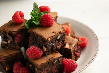 Wall Mural - Chocolate brownie with raspberries and cashews.