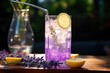 Lavender Lemonade: Stirring lavender-infused lemonade with ice.