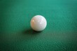 © Tisha - White snooker ball on the snooker green table surface. Sport equipment object.Top view,copy space.