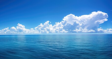 Wall Mural - Blue sea under the blue sky and white clouds, beautiful natural scenery