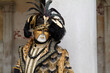 Venice, Italy - February 2024 - carnival masks are photographed with tourists in San Marco square