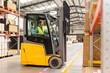 © Halfpoint - Female warehouse worker driving forklift. Warehouse worker preparing products for shipmennt, delivery, checking stock in warehouse.