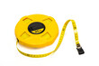 © ROM - Thirty meter flexible measuring tape on white background.
