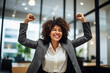 Happy african american successful business woman celebrate job success in office.