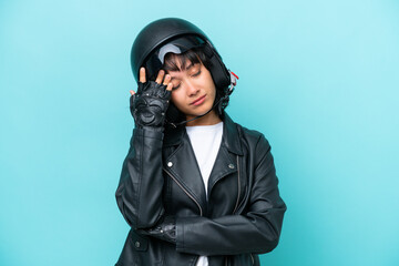 Wall Mural - Young Argentinian woman with a motorcycle helmet isolated on blue background with headache