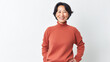 © BlazingDesigns - Portrait of positive confident mature asian woman standing over white background.