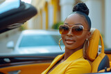 Fototapeta Londyn - a beautiful luxury black woman driving a car