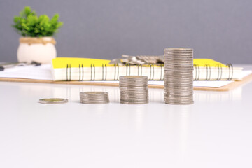 coin stack growth up on gray background. money saving, financial grow, business, economy budget and investment concept