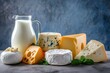 Front view of various kinds of dairy products like a milk jug, yogurt, butter and different types of cheese 