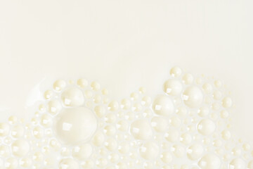 Wall Mural - White liquid with bubbles, surface of milk