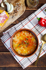 Wall Mural - Minestrone soup. Vegetable soup with grilled bread, ham and spices