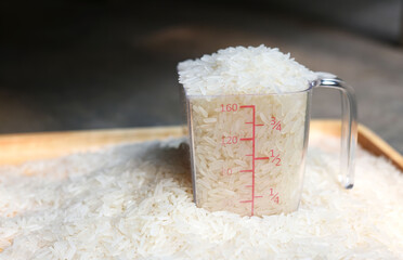 organic rice in a measure cup  . 