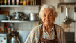 Old italian Grandma, Nonna stands in the kitchen, cooking italian traditional food and smiling into the camera, people lifestyle woman photography