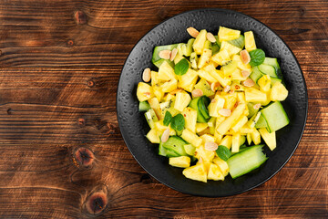 Wall Mural - Diet pineapple and cucumber salad.