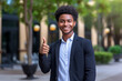 Young African American man with thumb up