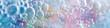 © Irina - Macro photo of bubbles in water. Background with foam made of soap, shampoo, lotion, detergent. Colorful banner with copy space for laundry and cleaning services, spa, beauty, skin care concept.
