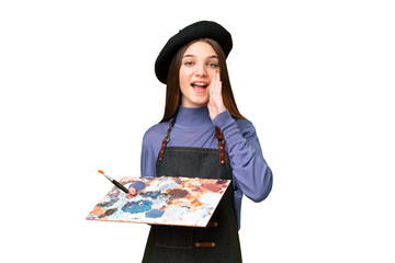 Sticker - Young artist man holding a palette over isolated chroma key background with surprise and shocked facial expression