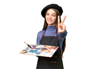 Poster - Young artist man holding a palette over isolated chroma key background smiling and showing victory sign