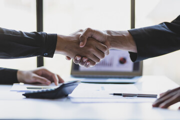 Wall Mural - Business people shaking hands in business partnership meeting.