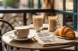 A charming bistro table set with croissants