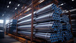 © ZethX - A warehouse stack of shiny new industrial metal tubes for construction and engineering.