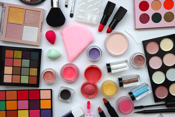 Various colorful beauty products on white background. Flat lay.