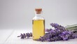 Spa still life with lavender oil and flowers on white background