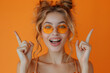 © Gonzalo - Photo of nice cheerful impressed person open mouth arm fingers demonstrate v-sign isolated on orange color background