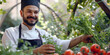 A chef man holds a bunch of vegetables in a greenhouse, showcasing healthy food options.