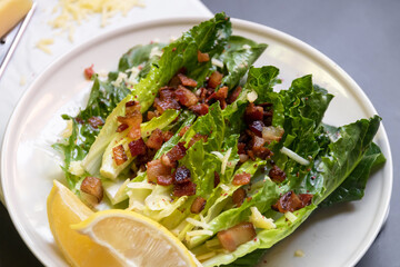 Wall Mural - Cos lettuce salad with crispy bacon, and parmesan cheese. Easy healthy recipes. 