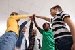 © New Africa - Happy children giving high five at school, low angle view