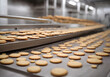 Production line of baking cookies. Conveyor with cookies. Many sweet cake food factory. Freshly baked shortbread cookies leave the oven. Cookies on a conveyor in a confectionery factory oven.