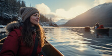 Portrait Of A Girl In A Wooden Canoe In The Middle Of The Lake. Winter Tourist Boat Trip.