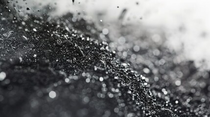 Poster - A close-up photo capturing the beauty of water in black and white. Suitable for various uses
