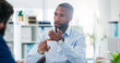 © Wesley/peopleimages.com - Business, black man and consultation with client, discussion and lens flare in office. Meeting, conversation and professional advisor planning, explain or communication for brainstorming work project