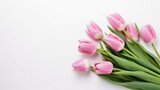 Fototapeta Tulipany - Pink tulip flowers bouquet on white background. Flat lay, top view