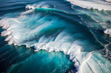 A Large Wave In The Ocean, Breaking Into White Foam. The Wave Is Blue And White, With A Texture Visible In The Foam. 