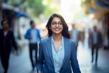 Fototapeta Nowy Jork - Indian businesswoman walking street smiling 