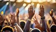hands raised by the crowd at a live music concert