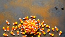 Bunch Of Candy Corn Sweets As Sybol Of Halloween Hoiday On Textured Background With A Lot Of Copy Space For Text Flat Lay Composition For All Hallows Eve Top View Shot