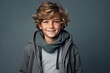 © Loli - Portrait of a cute little boy with blond curly hair. Studio shot.