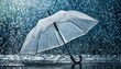 transparent umbrella under rain against water drops splash background rainy weather concept