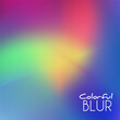 Colorful blur with multicolor gradient by red, purple, green and orange-yellow on blue background